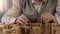 Male pensioner trying to make word of wooden cubes, old age dementia, rehab