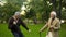 Male pensioners dancing park with walking sticks, friendship humor, having fun