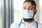 Male pensive thoughtful arab man therapist surgeon wear white uniform medical face mask standing at workplace looking