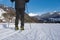 Male person cross-country skiing in beautiful winter landscape in mountains