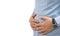 Male person suffering from abdominal pain, person holding belly area with hands