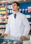 male pharmacist posing in drugstore