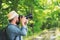 Male photographer with backpack and camera taking a photo. Travel Lifestyle hobby concept adventure active vacation