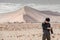 Male photographer taking photo in Namib desert