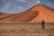 Male photographer taking photo in Namib desert