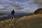 Male photographer with tripod on dramatic clifftop location near Mirador del Rio, Lanzarote