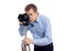 Male photographer or videographer taking photo or shooting video with modern dslr camera on tripod isolated on white