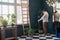 Male photographer working in stylish blue living room