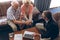 Male physician and senior couple discussing over laptop