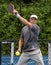 Male pickleball player hits a forehand shot .tif