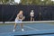 Male Pickleball Player Returns Serve