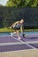 Male Pickleball Player Returns Serve