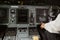 Male pilot pushing button on passenger airplane