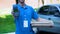 Male pizza courier holding credit card terminal, payment technology, service