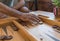 Male playing a traditional oriental board game of backgammon. Close-up Men`s hands moving chips