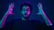 Male portrait neon ultraviolet background Arabian man Indian guy coder hacker showing head mind explosion gesture boom