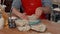 Male potter making ceramic bowl at his workshop