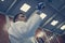 Male practicing judo in kimono with fight glove.