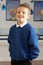 Male Primary School Pupil Standing In Classroom