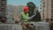 Male professional foreman builder young caucasian man at construction site works with drawing of technical documentation