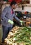 Male professional gardener sorting harvest of onion