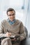 Male psychologist in glasses writing down