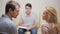 Male psychologist helping worried young couple. family therapy. angry people