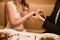 Male puts a wedding ring on a woman finger