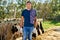 Male rancher in a farm cows.