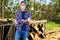 Male rancher in a mask virus protectionon at farm with dairy cows.