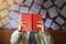 Male reader reading a red book in the bookstore.