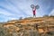 male rider lifting his fat bike on a sandstone cliff