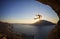 Male rock climber falling of a cliff at sunset