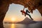 Male rock climber hanging with one hand on challenging route on cliff