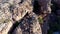 Male rock climber standing over a rocky mountain 4k