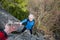 Male rockclimber is helping a climber female