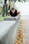 Male runner doing exercise, workout in the fall park. Push ups with bench.