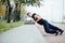 Male runner doing exercise, workout in the fall park. Push ups with bench.