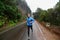 Male runner jogging and running on road in nature