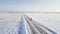 Male runner jogging on winter snowy road