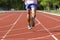 Male running at a track and field