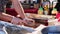 Male`s hands make cuts on piece of meat preparing it for barbeque grilling