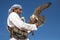 Male saker falcon during a falconry flight show in Dubai, UAE.