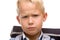 Male Schoolchild looks angry in camera