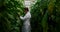 Male scientist examining aubergine in greenhouse 4k