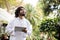 Male scientist inspecting plants at greenhouse