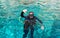 Male scuba diver gives \