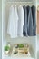Male shirts hanging in wardrobe