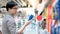 Male shopper choosing fizzy drink in supermarket