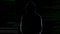 Male silhouette standing against numbers codes after committing cyber crime